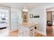 Charming breakfast nook area featuring an island with granite countertops and glass block wall at 6192 S Pennsylvania St, Centennial, CO 80121