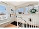 Bright entryway with wood floors, white wainscoting, and bench seating at 6192 S Pennsylvania St, Centennial, CO 80121
