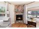 Close-up of stone fireplace with a wooden mantel and hearth at 6192 S Pennsylvania St, Centennial, CO 80121