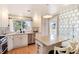 Bright kitchen with stainless steel appliances, island with seating, and lots of light at 6192 S Pennsylvania St, Centennial, CO 80121