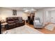 Basement living room area with hardwood floors, seating and desk area at 6192 S Pennsylvania St, Centennial, CO 80121