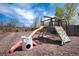 Backyard playground set with slide, climbing wall, and swing at 6192 S Pennsylvania St, Centennial, CO 80121