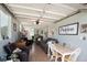 Inside the garage is a studio space complete with furniture, decorations, and a mini fridge at 6192 S Pennsylvania St, Centennial, CO 80121