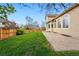 Backyard featuring green grass, brick patio, and privacy fence at 9515 Dolton Way, Highlands Ranch, CO 80126