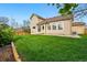 Spacious backyard with lush green grass and a private patio at 9515 Dolton Way, Highlands Ranch, CO 80126