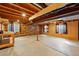 Basement area showcasing wooden framing, concrete floor, and paneled walls at 9515 Dolton Way, Highlands Ranch, CO 80126