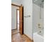 Bathroom featuring a shower/tub combo and an open doorway to another room at 9515 Dolton Way, Highlands Ranch, CO 80126