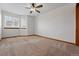 Bright bedroom featuring a ceiling fan and multiple large windows at 9515 Dolton Way, Highlands Ranch, CO 80126