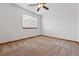Bedroom with neutral carpet, white walls, and a window at 9515 Dolton Way, Highlands Ranch, CO 80126