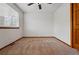 Bedroom featuring neutral carpet, white walls, and a closet door at 9515 Dolton Way, Highlands Ranch, CO 80126