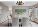 Elegant dining room featuring a modern glass table with seating for six and a stylish light fixture at 9515 Dolton Way, Highlands Ranch, CO 80126