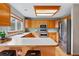Bright kitchen featuring light wood cabinets, stainless steel appliances, and ample countertop space at 9515 Dolton Way, Highlands Ranch, CO 80126