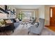 Relaxing living room featuring stylish furniture, neutral tones, and a bright window at 9515 Dolton Way, Highlands Ranch, CO 80126