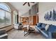 Open concept living room with large windows, high ceilings, and contemporary furnishings at 9515 Dolton Way, Highlands Ranch, CO 80126
