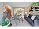Comfortable living room featuring stylish furniture, neutral tones, and a seamless flow to the dining area at 9515 Dolton Way, Highlands Ranch, CO 80126