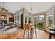 Living and dining area with a view of the fireplace and access to backyard at 9515 Dolton Way, Highlands Ranch, CO 80126