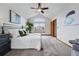 Bright main bedroom boasts vaulted ceilings, an arched window, and warm, inviting decor at 9515 Dolton Way, Highlands Ranch, CO 80126