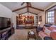 Open living room with a view into the kitchen and high ceilings at 5221 W Rowland Pl, Littleton, CO 80128