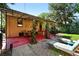 Outdoor area shows a covered patio, lounge furniture, and manicured landscaping at 1332 Ash St, Denver, CO 80220