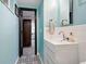 Stylish bathroom features a modern vanity with sleek fixtures and decorative tile flooring at 1332 Ash St, Denver, CO 80220