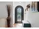 Inviting entryway with decorative door, hardwood floors, and accent furniture at 1332 Ash St, Denver, CO 80220