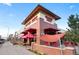 The exterior of the Trader Joe's grocery store shows a red-brick building with awnings and shopping carts at 1332 Ash St, Denver, CO 80220