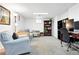 Cozy living room featuring a comfortable sectional sofa, plush armchair, and stylish decor at 1332 Ash St, Denver, CO 80220