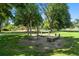 Outdoor exercise equipment located in a green park with walking paths and trees at 1332 Ash St, Denver, CO 80220