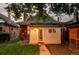 Backyard featuring white outbuilding with brick facade at dusk at 4430 Zuni St, Denver, CO 80211