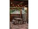 Outdoor patio featuring string lights, table with benches and decorative wooden fence at 4430 Zuni St, Denver, CO 80211