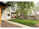 Beautiful backyard with privacy fence, arbor, and green grass at 4430 Zuni St, Denver, CO 80211