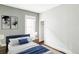 Bedroom with blue accents and a door that leads to a walk-in closet at 4430 Zuni St, Denver, CO 80211
