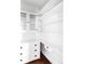 Custom built-in shelves and drawers for organization and storage in white finish at 4430 Zuni St, Denver, CO 80211