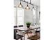 Well-lit dining area featuring a wooden table and stylish pendant lights above at 4430 Zuni St, Denver, CO 80211