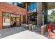 BACON Social House exterior featuring outdoor bar seating and dining area in a brick building at 4430 Zuni St, Denver, CO 80211