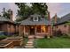 Charming brick home featuring a well-manicured lawn and inviting front entrance at 4430 Zuni St, Denver, CO 80211
