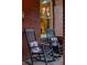 Inviting front porch with comfortable rocking chairs and charming details at 4430 Zuni St, Denver, CO 80211