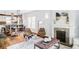 Cozy living room featuring hardwood floors, a decorative fireplace, and a stylish rug at 4430 Zuni St, Denver, CO 80211