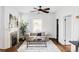 Bright living room with hardwood floors, fireplace and stylish decor at 4430 Zuni St, Denver, CO 80211