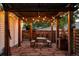 Outdoor patio with string lights and a dining set for entertaining at 4430 Zuni St, Denver, CO 80211
