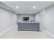 Basement living room features gray walls, plush carpeting, and recessed lighting at 482 W Caley Ave, Littleton, CO 80120