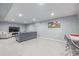 Spacious basement living area with plush carpeting and comfortable seating at 482 W Caley Ave, Littleton, CO 80120