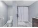 Cozy bathroom showcasing a toilet, shower with curtain, and vanity at 482 W Caley Ave, Littleton, CO 80120