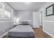 Small bedroom with hardwood floors, a window, and neutral colored walls at 482 W Caley Ave, Littleton, CO 80120