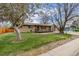 Beautiful home featuring a well-manicured lawn and a charming front porch, creating an inviting entrance at 482 W Caley Ave, Littleton, CO 80120