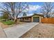 Charming single-story home with a spacious driveway and a cozy front porch, perfect for enjoying the sunset at 482 W Caley Ave, Littleton, CO 80120
