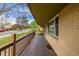 Spacious front porch offering a relaxing outdoor space with a view of the neighborhood street and green lawns at 482 W Caley Ave, Littleton, CO 80120