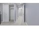 Bright hallway featuring neutral colors, a large closet and access to other rooms at 482 W Caley Ave, Littleton, CO 80120