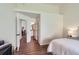 Spacious bedroom with a neutral color palette, showcasing an ensuite bathroom and closet offering functionality and elegance at 10239 W Fair Ave # A, Littleton, CO 80127