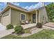 Charming front porch with seating and a welcoming entrance, complemented by fresh landscaping at 10239 W Fair Ave # A, Littleton, CO 80127